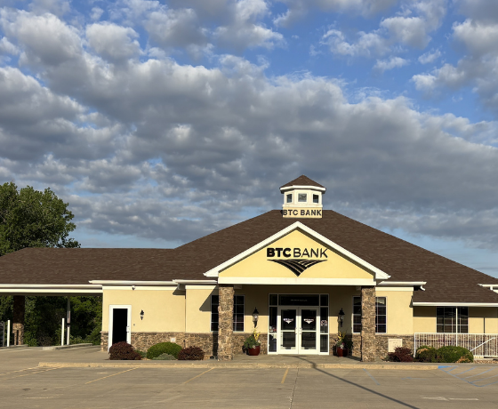 Exterior of tan and brick BTC Bank Carrollton branch building