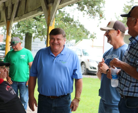 BTC Board member chats with people at a community function