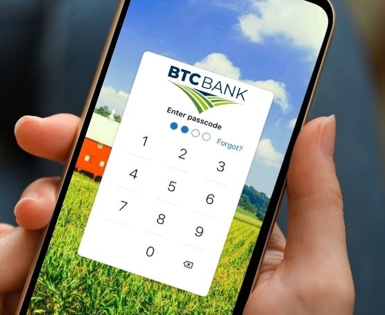 A preview of the BTC Bank mobile app on a smartphone