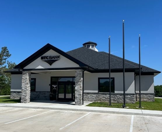 Exterior of a gray and black BTC Bank building.