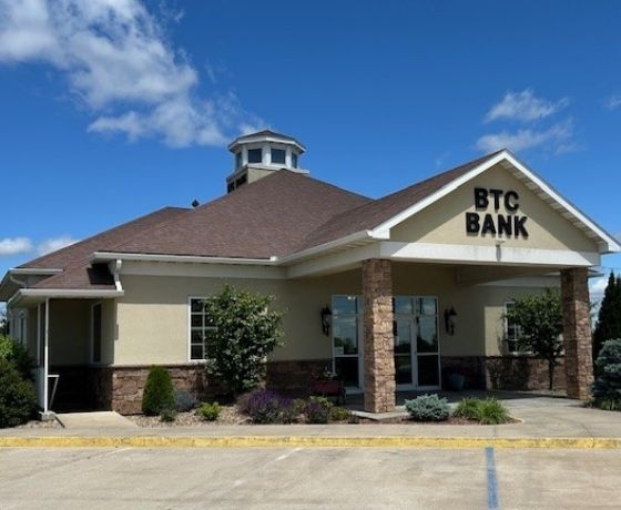 Exterior of tan and brick BTC Bank Lamoni branch building.